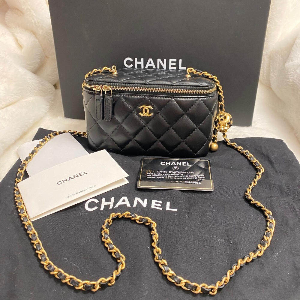 Authentic Chanel O-Sac-Vanity adjustable strap in black w/ gold interior